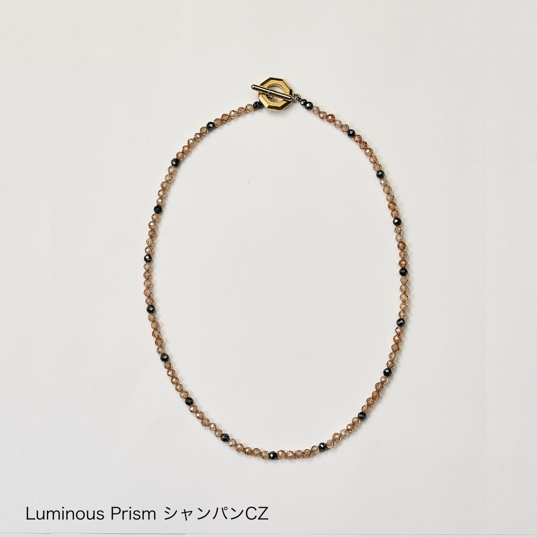 UNrust アンラスト Luminous Prism ルミナス プリズム 磁気ネックレス シャンパンCZ 商品単体 俯瞰